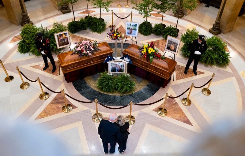 Minnesota Gov. Tim Walz and first lady Gwen Walz look on as DFL Rep. Melissa Hortman, her husband Mark Hortman, and their dog Gilbert lie in state in the rotunda of the Capitol building on June 27, 2025 in St. Paul, Minnesota.