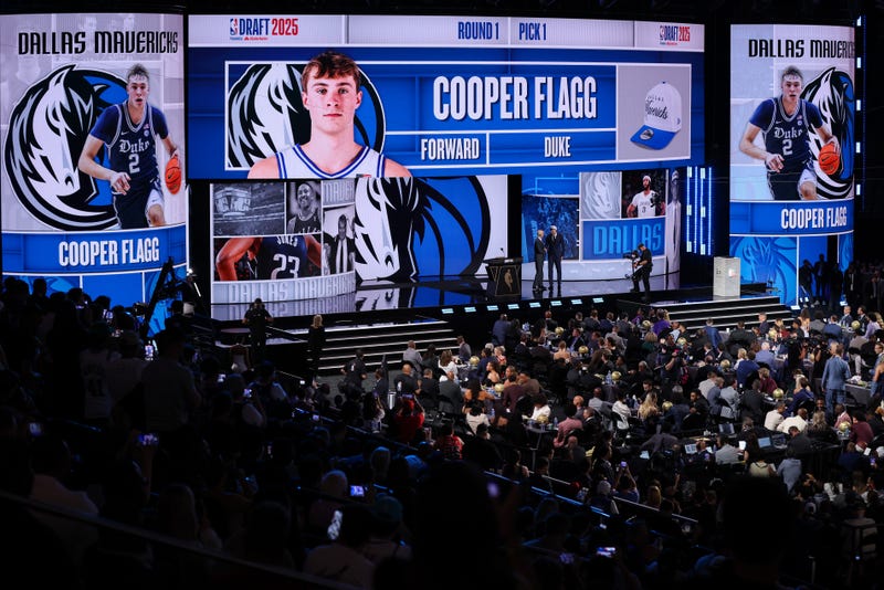 NEW YORK, NEW YORK - JUNE 25: Cooper Flagg (R) shakes hands with NBA commissioner Adam Silver (L) after being drafted first overall by the Dallas Mavericks during the 2025 NBA Draft at Barclays Center on June 25, 2025 in the Brooklyn borough of New York City. (Photo by Mike Lawrie/Getty Images)