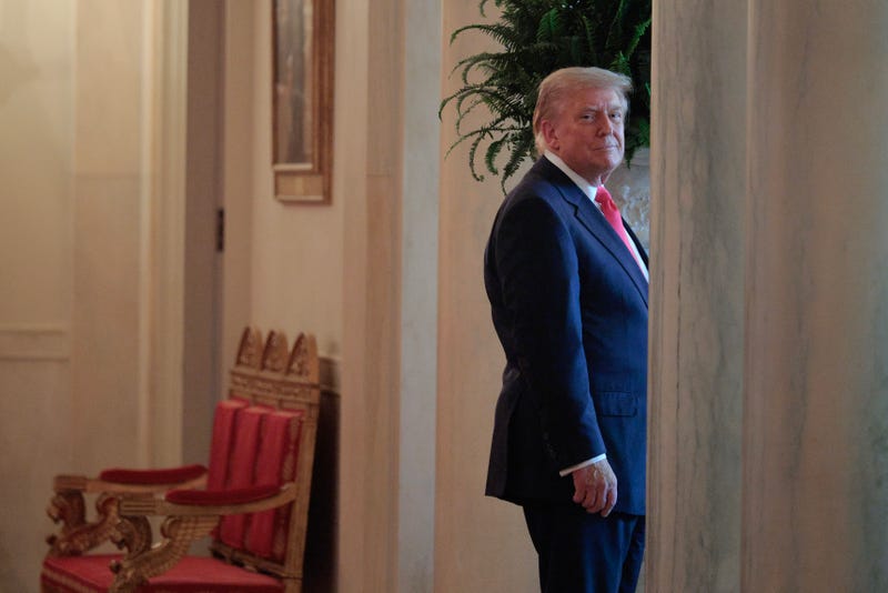 U.S. President Donald Trump stops in the White House Cross Hall to listen to the band at the conclusion of a "One, Big, Beautiful" event in the East Room of the White House on June 26, 2025 in Washington, DC. Trump held an event to urge the passage of the "One, Big, Beautiful Bill," Trump's signature tax-and-spending agenda. 