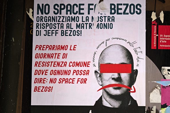 A "No Space for Bezos" mural in Venice streets on the Jeff Bezos and Lauren Sanchez Wedding day on June 27, 2025 in Venice, Italy. The 'No Space for Bezos' committee opposes the rental of some part of the city of Venice for the wedding of Amazon Group founder, owner and chairman Jeff Bezos to Lauren Sanchez. (Photo by Vittorio Zunino Celotto/Getty Images)