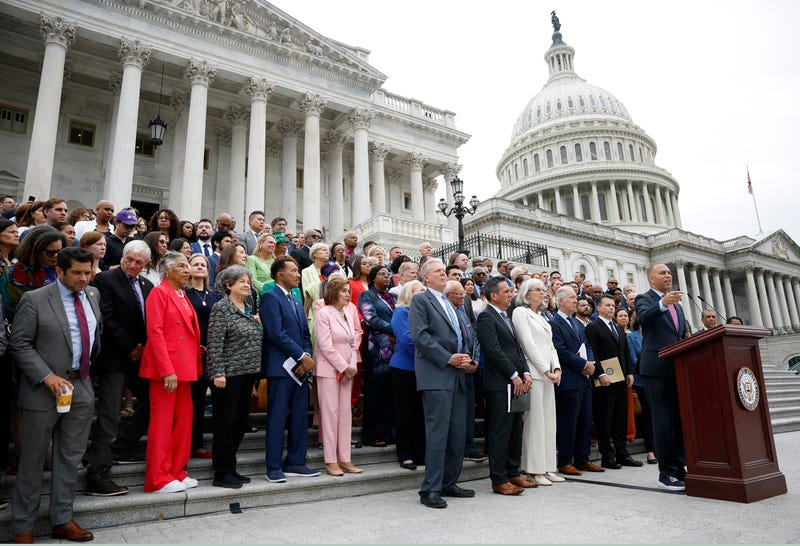 Members of Congress gather on Capitol steps