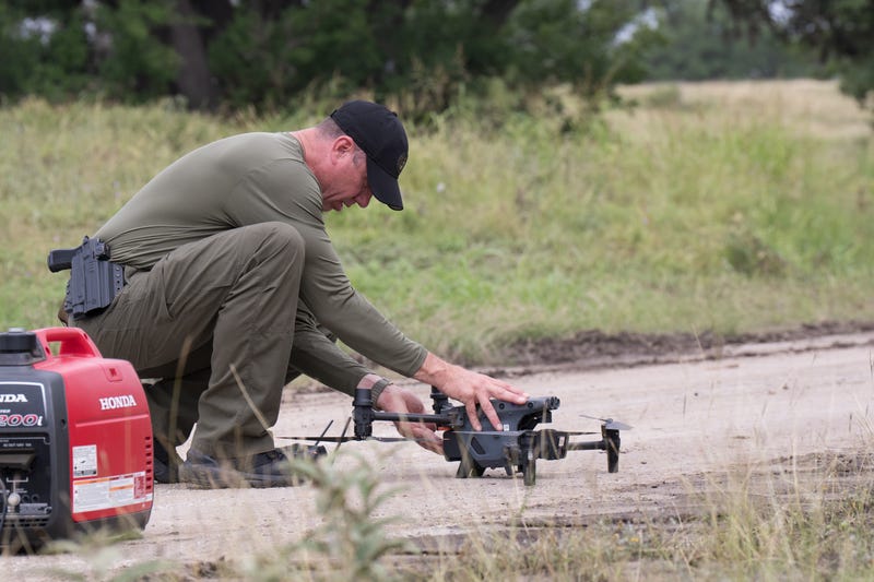 A U.S. Border Patrol officer operates a drone during search operations on July 6, 2025 in Kerrville, Texas. 