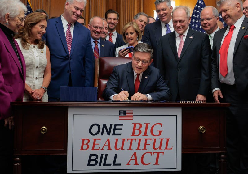 Speaker of the House Mike Johnson (R-LA) (C) signs the One Big Beautiful Bill Act during an enrollment ceremony with fellow Republicans including Minnesota Rep. Tom Emmer (standing, left) in the Rayburn Room at the U.S. Capitol on July 03, 2025 in Washington, DC. 