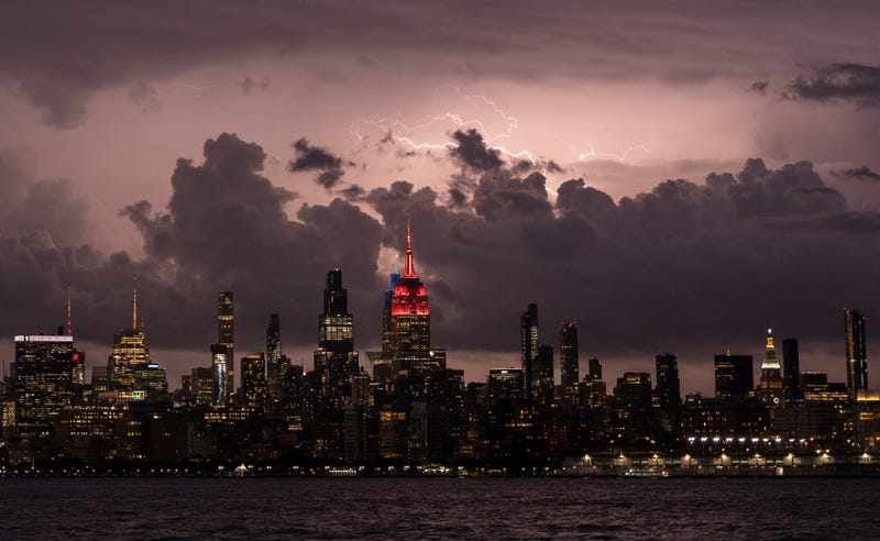Lightning is seen over the Midtown Manhattan skyline during a storm in June