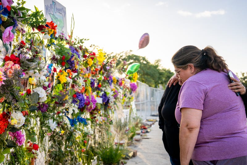 KERRVILLE, TEXAS - JULY 10: Community residents grieve and pay their respects at a memorial on July 10, 2025 in Kerrville, Texas. Last Friday, heavy rainfall caused severe flash flooding throughout the hill country and various cities along the Guadalupe River. (Photo by Brandon Bell/Getty Images)