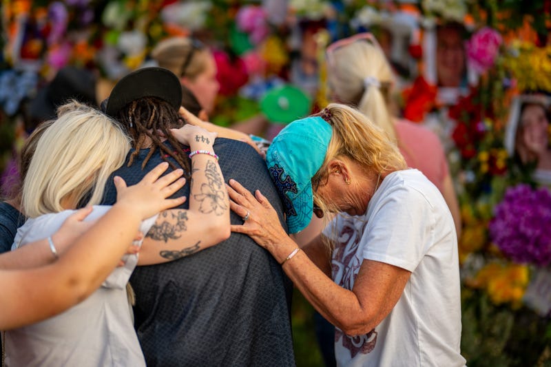 KERRVILLE, TEXAS - JULY 11: Community members gather during a candlelight vigil to honor the lives lost in the flash floods that claimed more than 120 lives on July 11, 2025 in Kerrville, Texas. More than 160 people are still missing after storms cells halted over the area, dumping nearly 15 inches of rain and causing a 22-foot rise along the Guadalupe River. (Photo by Brandon Bell/Getty Images)