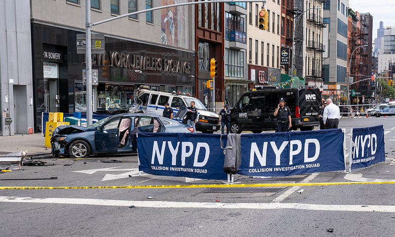 A man riding a yellow bicycle and a woman walking on the sidewalk were pronounced dead on scene after a blue Chevy Malibu sedan, driven by a woman with a female passenger, smashed into them after losing control in the Manhattan bound lanes of the Manhattan Bridge in New York on Saturday, July 19, 2025. 