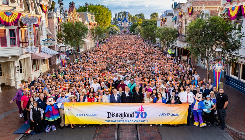  In this handout image provided by Disneyland Resort, Disney Experiences Chairman Josh D’Amaro The Walt Disney Company Chief Executive Officer Bob Iger (C) and cast pose for a photo during the 70th anniversary celebrations of Disneyland Resort on July 17, 2025 in Anaheim, California.