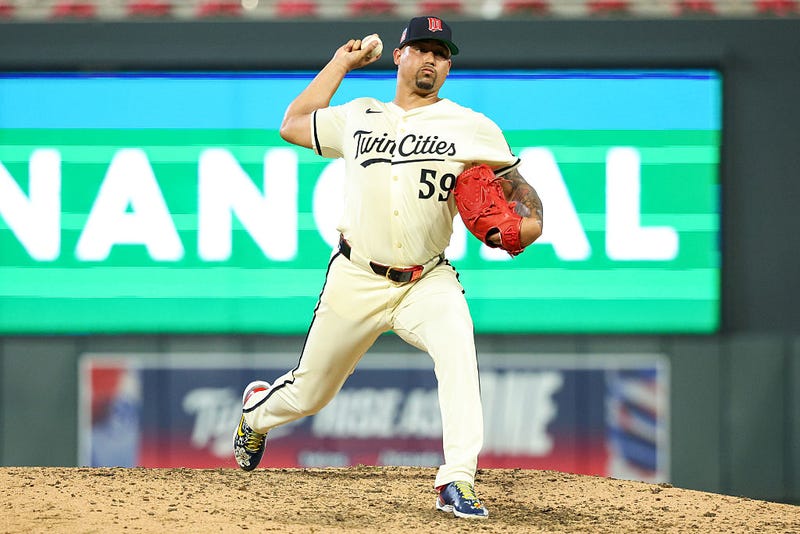 Jhoan Duran #59 of the Minnesota Twins delivers a pitch against the Washington Nationals during the ninth inning at Target Field on July 25, 2025 in Minneapolis, Minnesota. 