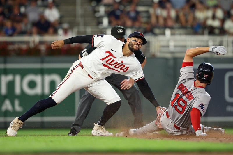 Carlos Correa #4 of the Minnesota Twins tags out Roman Anthony #19 of the Boston Red Sox at second base on a steal attempt during the ninth inning at Target Field on July 28, 2025 in Minneapolis, Minnesota. 