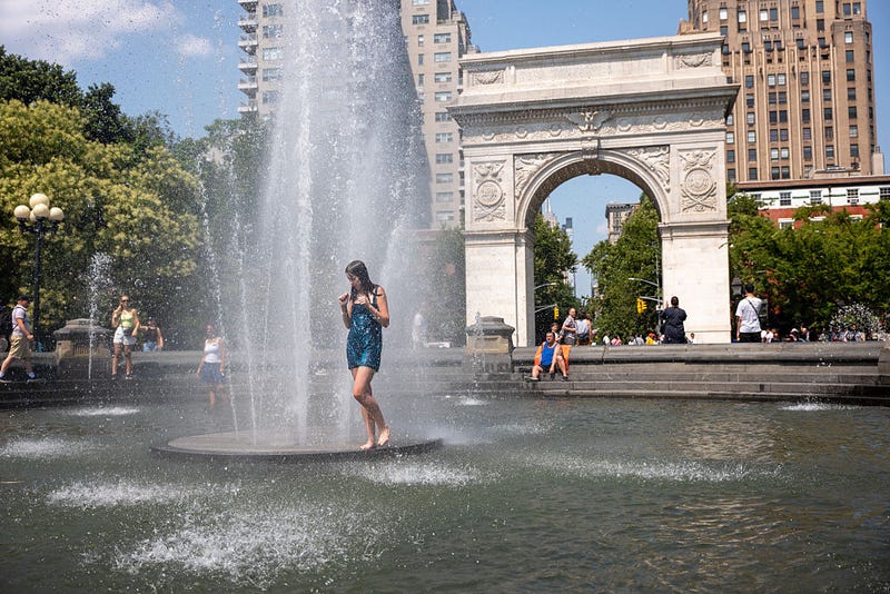 People cool off in a fountain in Washington Square Park as the region experiences another heatwave on July 29, 2025 in New York City. Temperatures are expected to reach into the high 90s with a heat index well above 100 degrees.