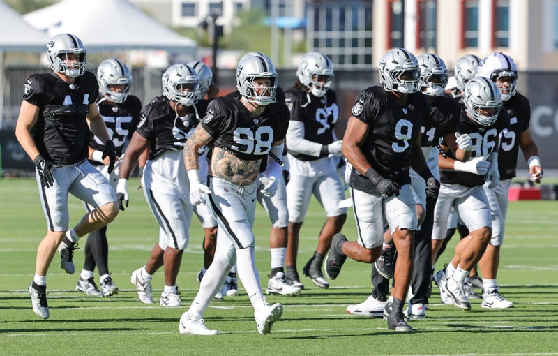  Las Vegas Raiders defensive players, including Maxx Crosby #98 and Tyree Wilson #9, practice during the team's training camp at the Las Vegas Raiders Headquarters/Intermountain Health Performance Center on July 31, 2025 in Henderson, Nevada.
