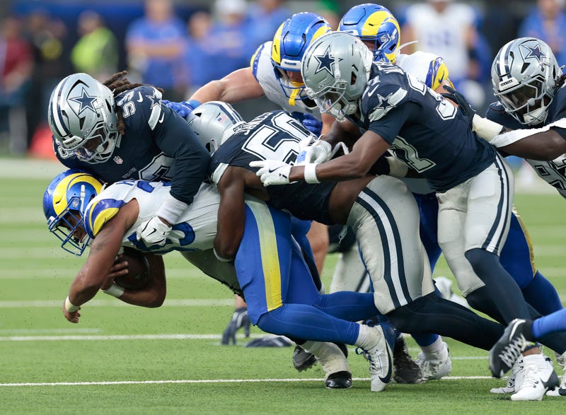 INGLEWOOD, CALIFORNIA - AUGUST 09: Jarquez Hunter #35 of the Los Angeles Rams is tackled by James Houston #53 of the Dallas Cowboys in the second half of a NFL Preseason 2025 at SoFi Stadium on August 09, 2025 in Inglewood, California. (Photo by Ronald Martinez/Getty Images)