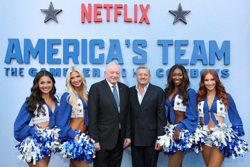 LOS ANGELES, CALIFORNIA - AUGUST 11: (L-R) Reece Weaver and Sophy Laufer of Dallas Cowboys Cheerleaders, Jerry Jones, Owner, President & GM, Dallas Cowboys and Ted Sarandos, Co-CEO, Netflix and Camille Sturdivant and Charly Barby of Dallas Cowboys Cheerleaders attend the premiere of Netflix's "America's Team: The Gambler and His Cowboys" at The Egyptian Theatre Hollywood on August 11, 2025 in Los Angeles, California. (Photo by Amy Sussman/Getty Images for Netflix)
