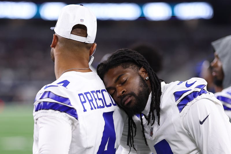 ARLINGTON, TEXAS - AUGUST 16: Trevon Diggs #7 of the Dallas Cowboys leans against Dak Prescott #4 during the second half of the NFL Preseason 2025 game against the Baltimore Ravens at AT&T Stadium on August 16, 2025 in Arlington, Texas. (Photo by Sam Hodde/Getty Images)