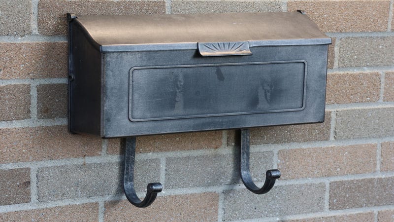 Traditional black metallic mailbox - stock photo