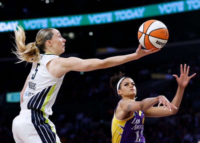 Paige Bueckers #5 of the Dallas Wings attempts a layup in front of Rae Burrell #12 of the Los Angeles Sparks during the first half at Crypto.com Arena on August 20, 2025, in Los Angeles, California.