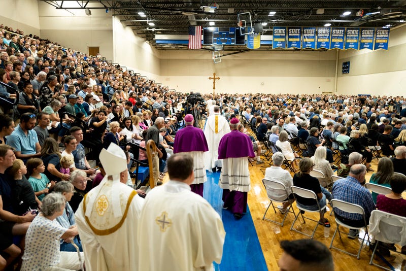 Members of Catholic clergy arrive at a vigil following a mass shooting at Annunciation Catholic School on August 27, 2025 in Richfield, Minnesota