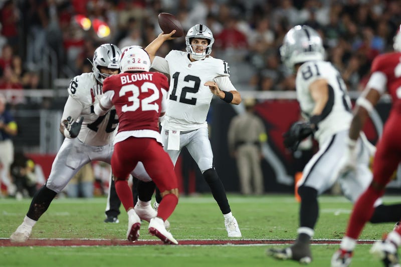 Quarterback Aidan O'Connell #12 of the Las Vegas Raiders throws a pass during first half of the NFL preseason 2025 game against the Arizona Cardinals at State Farm Stadium on August 23, 2025 in Glendale, Arizona. 
