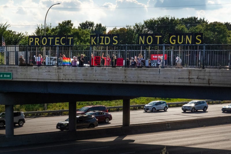 Activists across the Twin Cities have been demonstrating, including here on an overpass over Interstate 94, and calling for tougher gun laws following the shooting last week at Annunciation Catholic Church in Minneapolis.