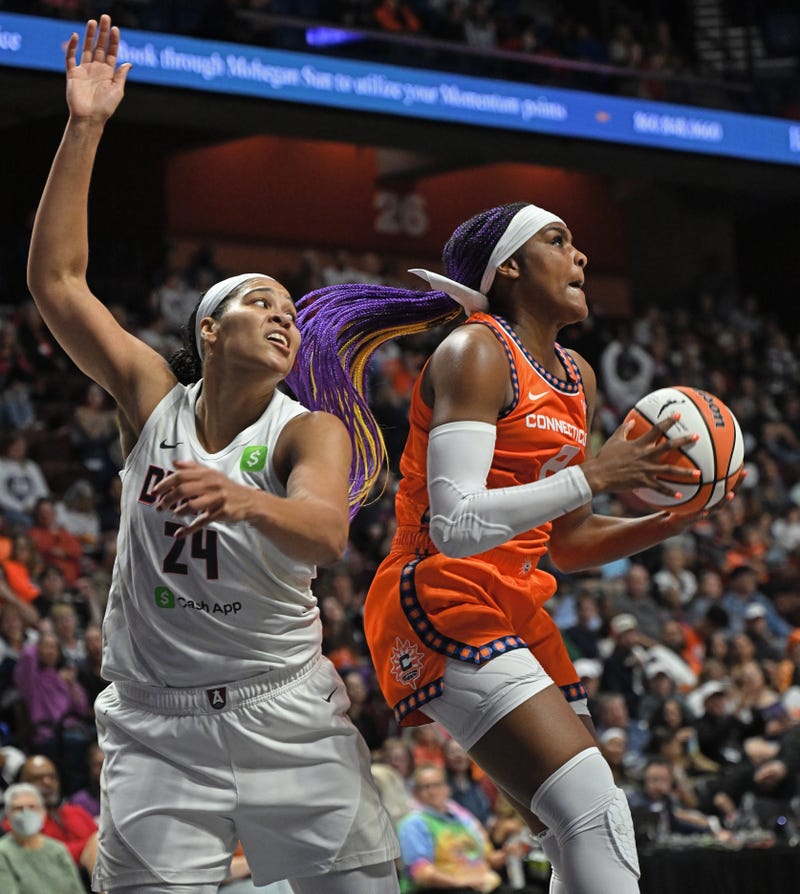  Aaliyah Edwards #8 of the Connecticut Sun takes the rebound from Brionna Jones #24 of the Atlanta Dream in the first half at Mohegan Sun Arena on September 10, 2025 in Uncasville, Connecticut.