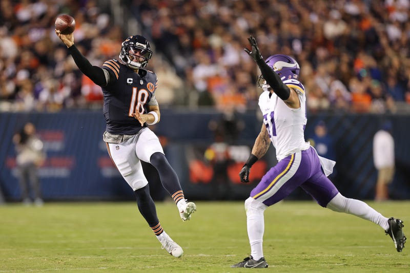 Caleb Williams #18 of the Chicago Bears throws a pass around Blake Cashman #51 of the Minnesota Vikings during the first quarter at Soldier Field on September 08, 2025 in Chicago, Illinois. 