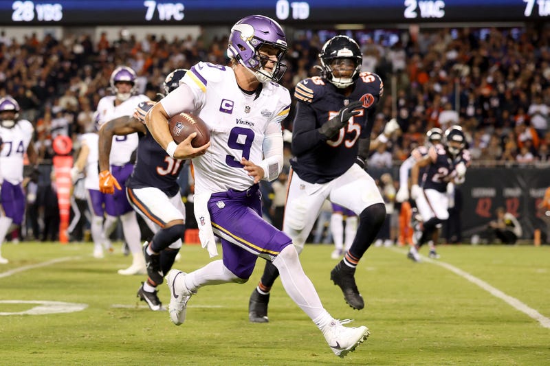 J.J. McCarthy #9 of the Minnesota Vikings runs for a touchdown against the Chicago Bears during the fourth quarter at Soldier Field on September 08, 2025 in Chicago, Illinois. 