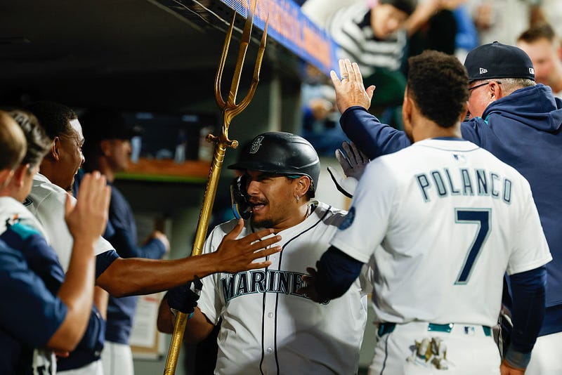 Josh Naylor #12 of the Seattle Mariners celebrates with teammates after hitting a one-run home run during the fourth inning against the St. Louis Cardinals at T-Mobile Park on September 09, 2025 in Seattle, Washington.