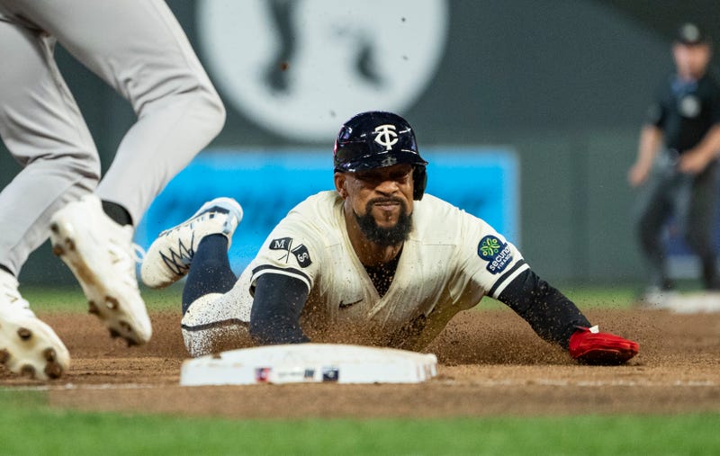 Byron Buxton #25 of the Minnesota Twins steals third base against the New York Yankees in the sixth inning of the game at Target Field on September 16, 2025 in Minneapolis, Minnesota.