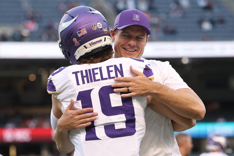 Adam Thielen #19 of the Minnesota Vikings hugs head coach Kevin O'Connell prior to the game against the Chicago Bears at Soldier Field on September 08, 2025 in Chicago, Illinois.