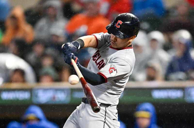 Steven Kwan #38 of the Cleveland Guardians hits an RBI double against the Minnesota Twins in the ninth inning of the game at Target Field on September 19, 2025 in Minneapolis, Minnesota. 