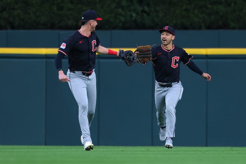 Steven Kwan #38 of the Cleveland Guardians celebrates a catch in the second inning with Nolan Jones #22 while playing the Detroit Tigers at Comerica Park on September 17, 2025 in Detroit, Michigan.