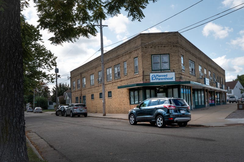 A sign hangs above the front door of a Planned Parenthood clinic on September 25, 2025 in Kenosha, Wisconsin. Planned Parenthood of Wisconsin will reportedly pause scheduling abortion appointments starting Oct. 1, due to fears of losing Medicaid funding because of a provision in the Trump administration's federal funding bill which bars clinics that provide abortions from accepting Medicaid funds for any of their other reproductive services. 