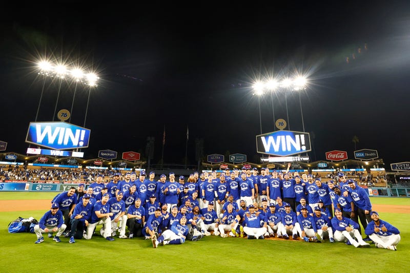 Members of the Los Angeles Dodgers pose for a team photo after defeating the Cincinnati Reds to win National League Wild Card Series at Dodger Stadium on October 01, 2025 in Los Angeles, California.