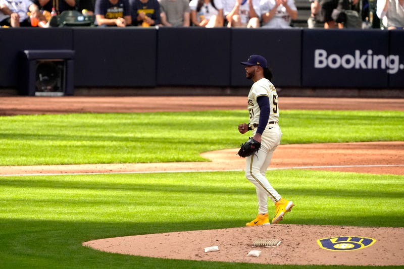 Freddy Peralta #51 of the Milwaukee Brewers reacts as he walks to the dugout during the fifth inning against the Chicago Cubs in game one of the Division Series at American Family Field on October 04, 2025 in Milwaukee, Wisconsin.