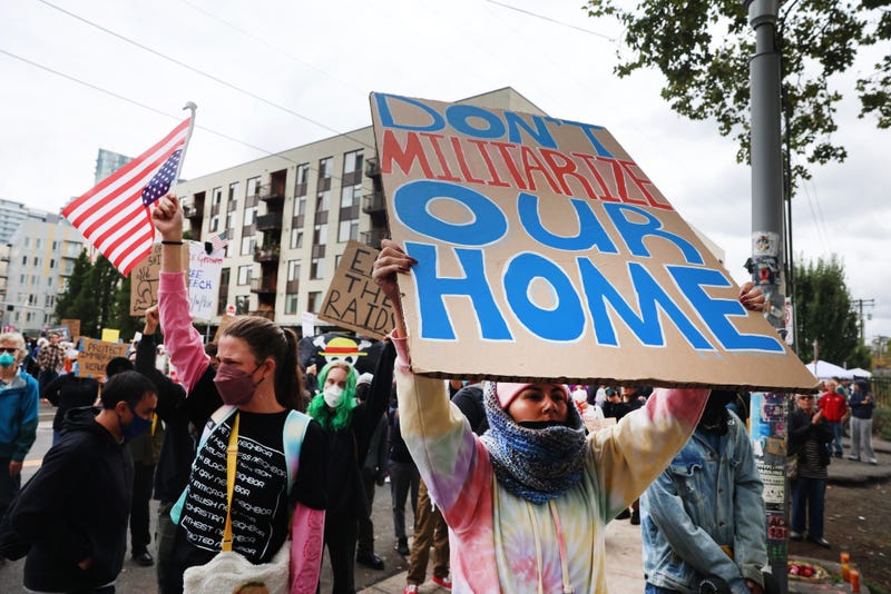 Protesters gather outside of a downtown U.S. Immigration and Customs Enforcement (ICE) facility on October 04, 2025 in Portland, Oregon. 