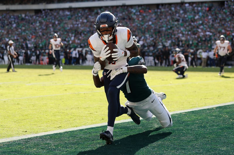 Troy Franklin of the Denver Broncos makes a reception to score a two-point conversion against Kelee Ringo of the Philadelphia Eagles during the fourth quarter in the game at Lincoln Financial Field on October 05, 2025.