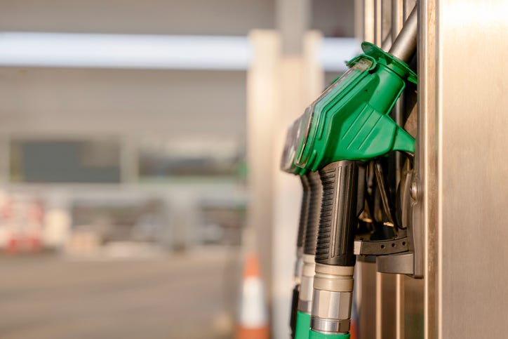 Close-up of filling nozzles for petrol and diesel at gasoline fuel station