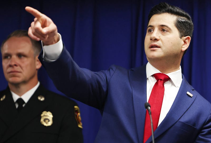 Acting U.S. Attorney Bill Essayli (R) gestures at a press conference announcing an arrest in the Palisades Fire investigation on October 08, 2025 in Los Angeles, California.