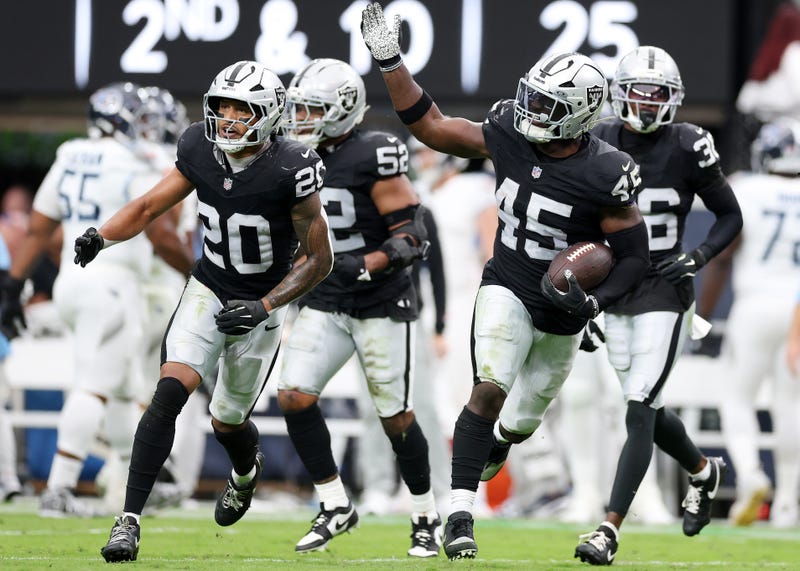 Devin White #45 of the Las Vegas Raiders celebrates after his interception against the Tennessee Titans with Isaiah Pola-Mao #20 during the second quarter in the game at Allegiant Stadium on October 12, 2025 in Las Vegas, Nevada.