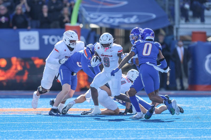 Running back Jai'Den Thomas #9 of the UNLV Rebels looks to break into the open field during the first half against the Boise State Broncos at Albertsons Stadium on October 18, 2025 in Boise, Idaho.