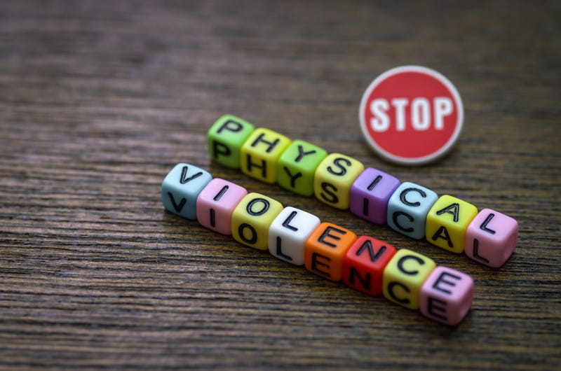 A button and block letters spelling "Stop Physical Violence"