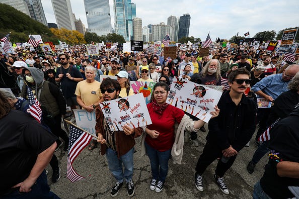 Protestors march in the second "No Kings" protest on October 18, 2025 in Chicago, Illinois. Organizers expect millions to participate in cities and towns across the nation for the second "No Kings" protest to denounce the Trump administration. (Photo by Scott Olson/Getty Images)