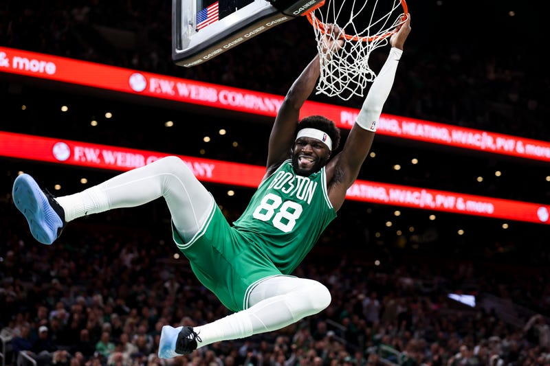 Neemias Queta #88 of the Boston Celtics dunks the ball in the fourth quarter of the game against the Philadelphia 76ers at TD Garden on October 22, 2025 in Boston, Massachusetts.