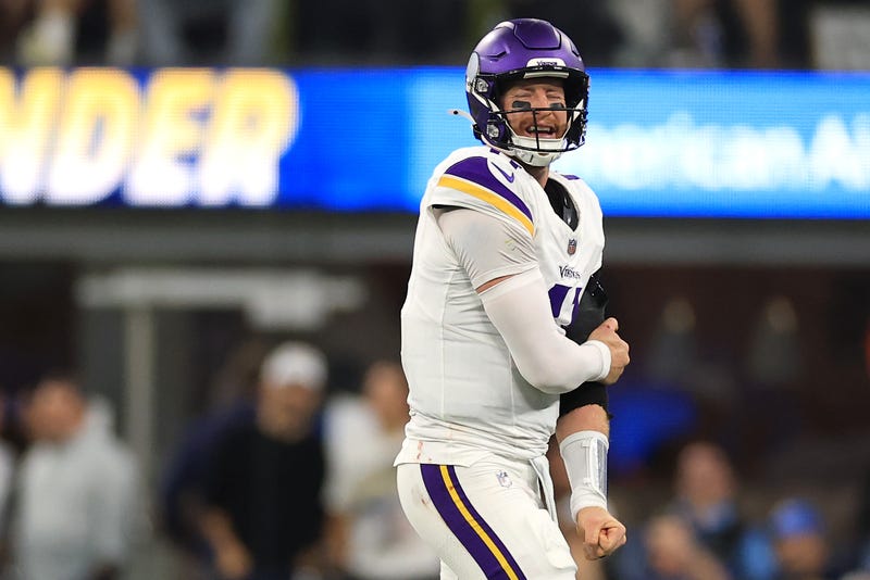 Carson Wentz #11 of the Minnesota Vikings reacts as he holds his arm after a play against the Los Angeles Chargers during the second quarter in the game at SoFi Stadium on October 23, 2025 in Inglewood, California.