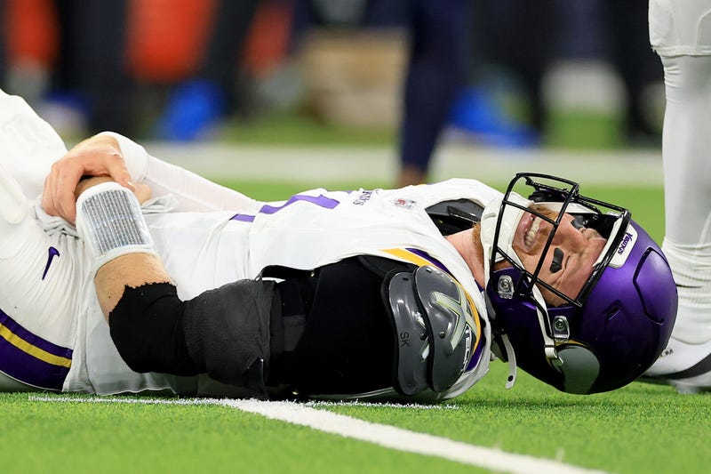 Carson Wentz #11 of the Minnesota Vikings reacts in pain on the ground after a play against the Los Angeles Chargers during the fourth quarter in the game at SoFi Stadium on October 23, 2025 in Inglewood, California. 