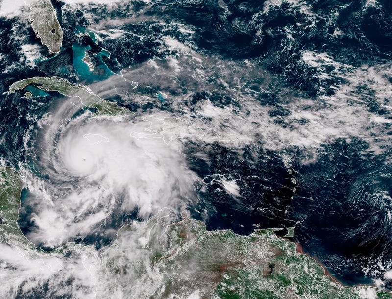 In this handout satellite image provided by the National Oceanic and Atmospheric Administration (NOAA), Hurricane Melissa churns northwest through the Caribbean Sea captured at 17:00Z on October 27, 2025. Hurricane Melissa has intensified into a Category 5 storm as it approaches Jamaica, according to the National Hurricane Center.