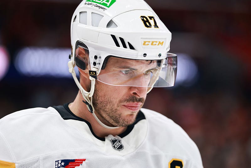 Sidney Crosby with head down on ice