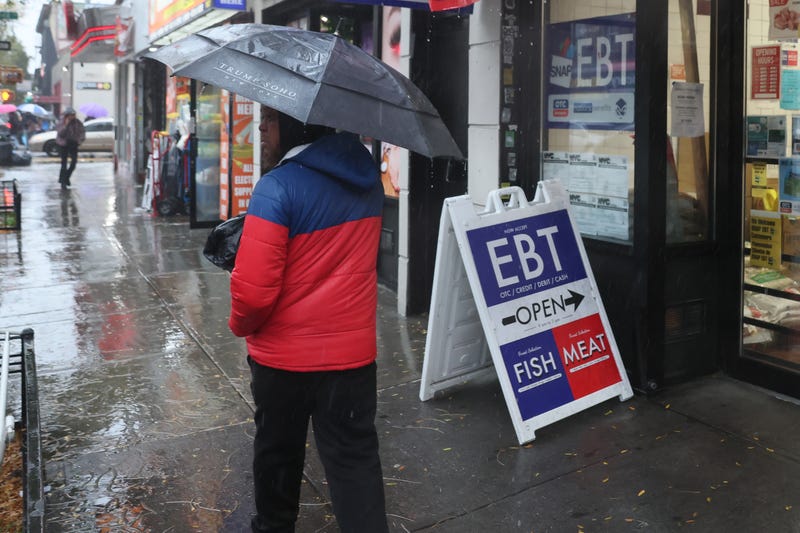 An EBT sign is displayed on the window of a grocery store in Flatbush last October