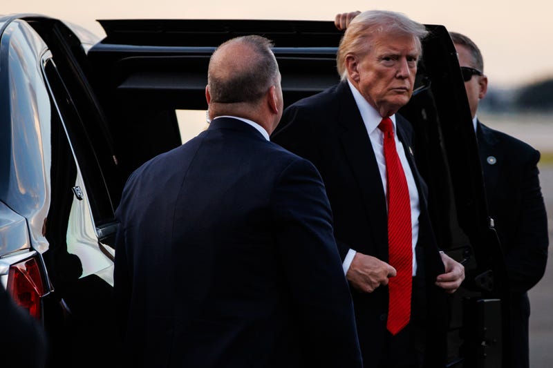 President Donald Trump steps out of the Presidential limousine before boarding Air Force One en route to the White House on November 2, 2025 at Palm Beach International Airport in West Palm Beach, Florida